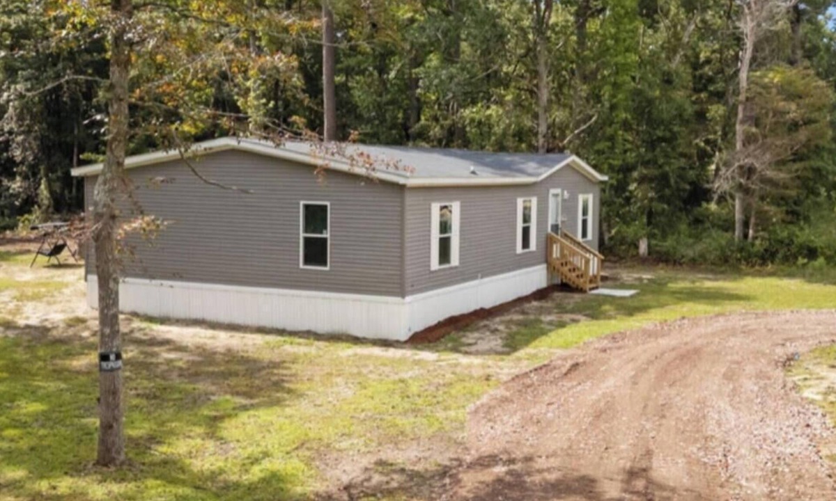 Supply House | Charming house close to Holden Beach in Supply with ample parking for your boat.