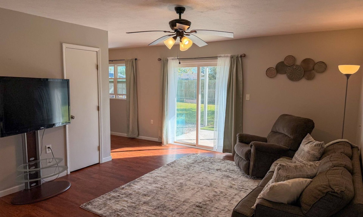 Lake Charles Apartment | Charming Two-Story Quadplex with Bedroom Balcony & Living Room Patio