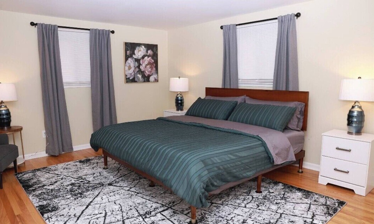 Commerce Township House | Cozy spacious 4-bedroom home nestled in wooded lot with enclosed porch