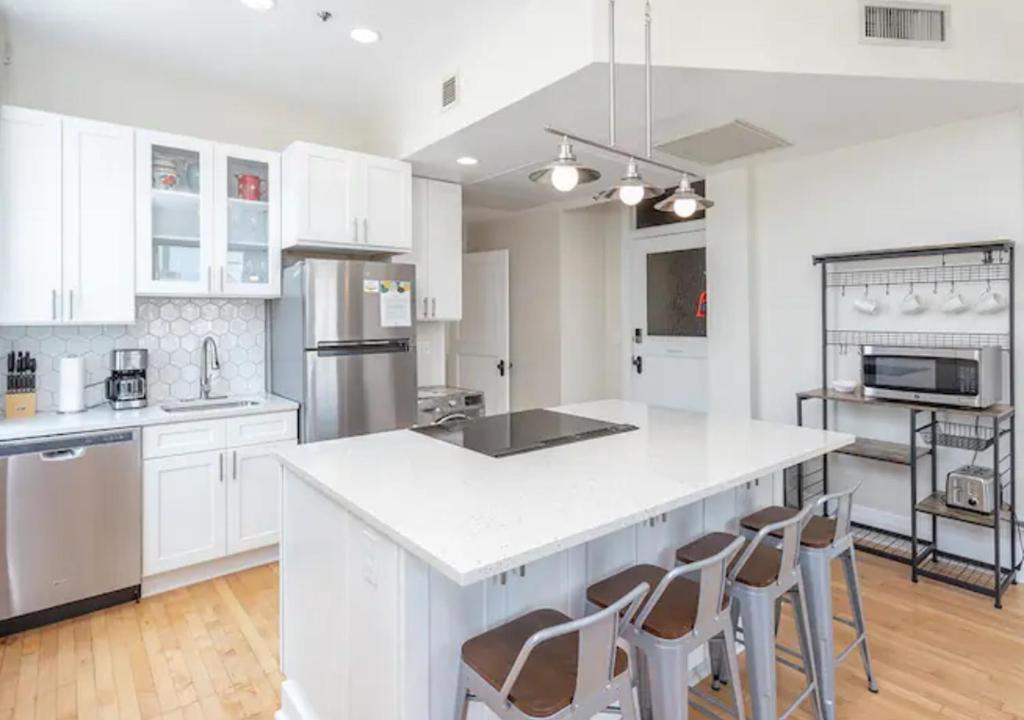 Boise Apartment | Downtown Digs-View of the City! Stay above local restaurants and nightlife, posh amenities heated toilet seat, oversized rain shower head in glass shower, in-unit laundry, one garage parking spot