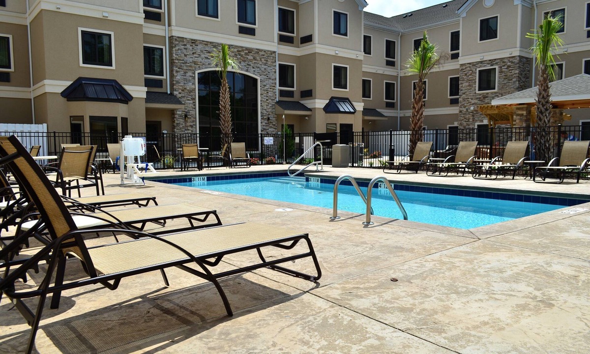 Jacksonville Apartment | Free Breakfast. Outdoor Pool. Shared BBQ. Great for Business Travel.
