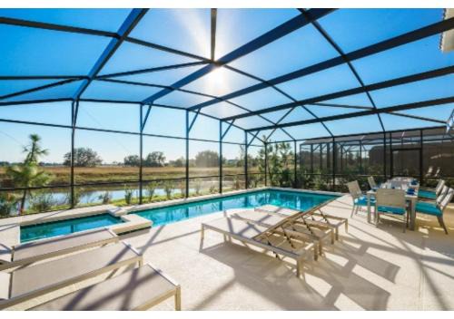 Crescent Lakes House | Fully Refurbished Vacation Home with South Facing Pool and Spa with Lake View in Quiet Community Nr Disney