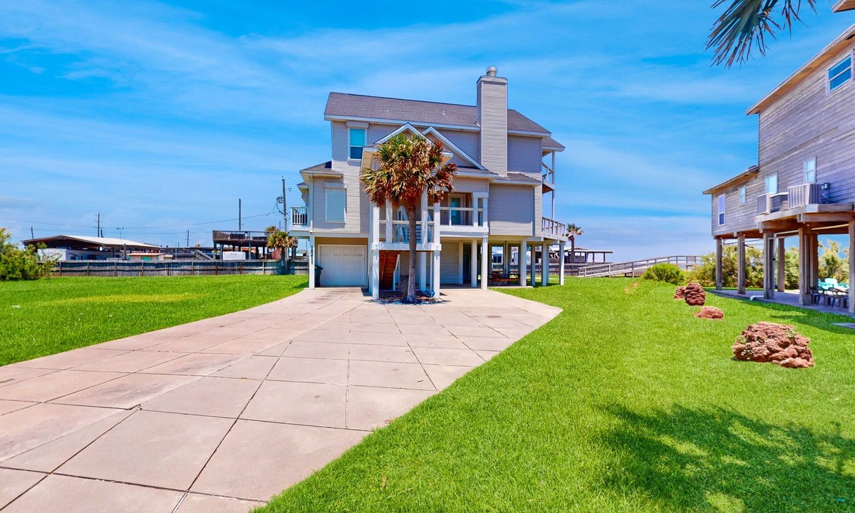 Indian Beach House | Galveston home with open floor, balcony, patio and water views