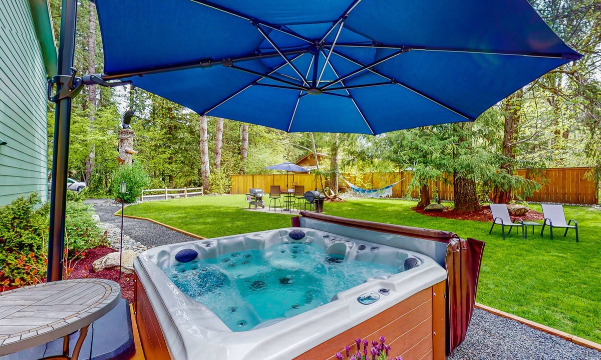 Mason County House | Inviting riverfront home with hot tub, firepit, W/D, & dog-friendly