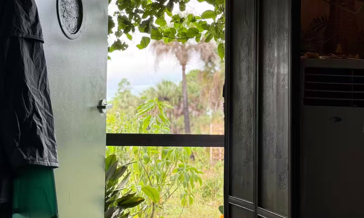 Rural Estates Cabin | Luxury off-grid passionfruit covered shipping container immersed in nature.