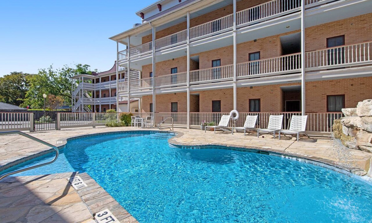 Gruene Condo | River view condo with a pool, washer/dryer, central AC - snowbirds welcome