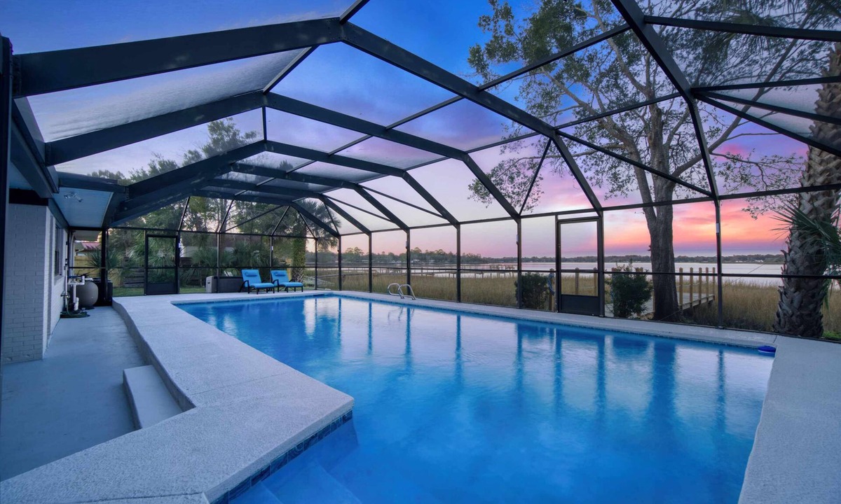 Riverview House | Super Mario's Riverside Hideaway: Unique Family Fun with Pool & Games