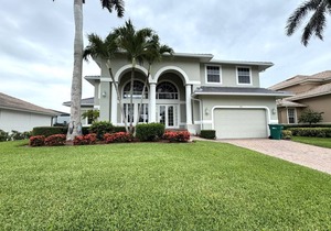 Enjoy Sunny warm days, lounging poolside at this home