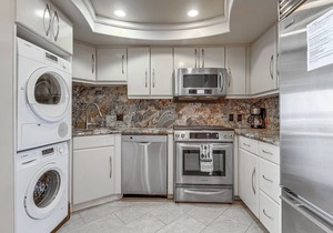 Oceanfront condo with private waterfront patio, washer/dryer, gas grill