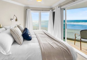 Upper level beachfront condo w/incredible views, gas fireplace, decks, & W/D