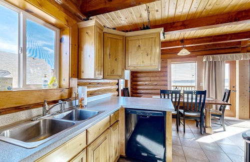 Harbor Village Cabin | Beautiful log cabin with lake views, wraparound deck, & foosball