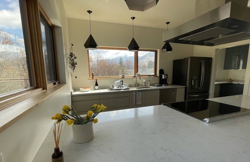 Riverfront Apartment | Modern, bright and spacious apartment with mountain views.
