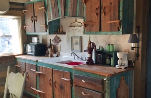 Madison Cabin | 1800’s restored log cabin on 26 private rolling wooded acres with sunset views