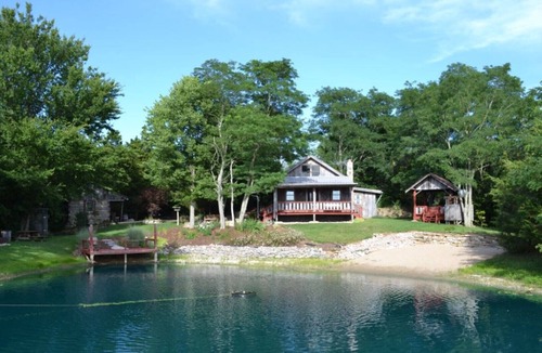 Madison Cabin | 1800’s restored log cabin on 26 private rolling wooded acres with sunset views