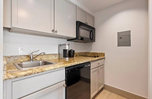 FM 1960 Hotel | 4 Restful Rooms Ideal for Weekend Group Adventures + Outdoor Pool Access