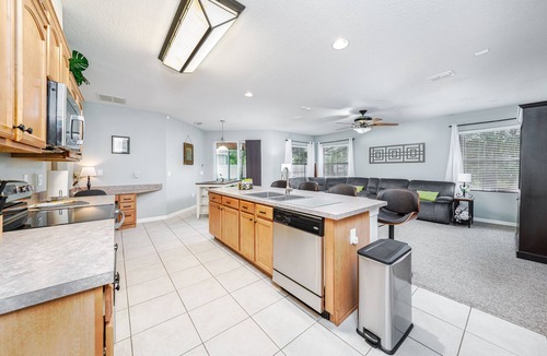 Wedgefield House | A peaceful tropical oasis with a large saltwater pool and spa hot tub.