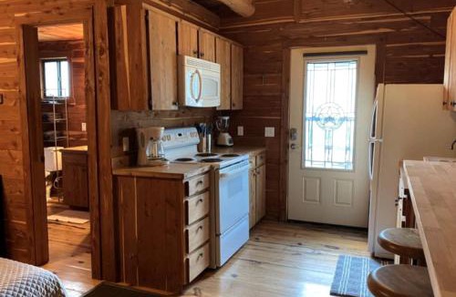 Prairie Lea House | A Rustic Log Cabin - Perfect for a Glamping Getaway by the San Marcos River near Kingsbury, Texas