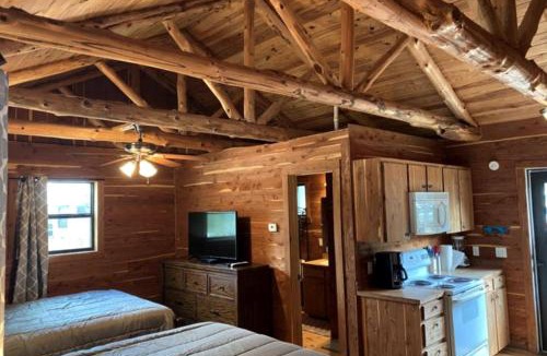 Prairie Lea House | A Rustic Log Cabin - Perfect for a Glamping Getaway by the San Marcos River near Kingsbury, Texas