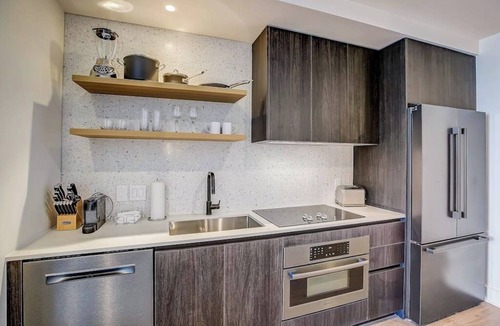 Rainey Street Historic District Apartment | Austin Rainey Street studio - lake & skyline-view balcony, rooftop pool & gym