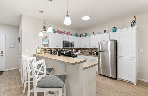 Port Isabel House | Bayfront Home with Shared Pool, Dock, Balcony, Playground and Washer/Dryer