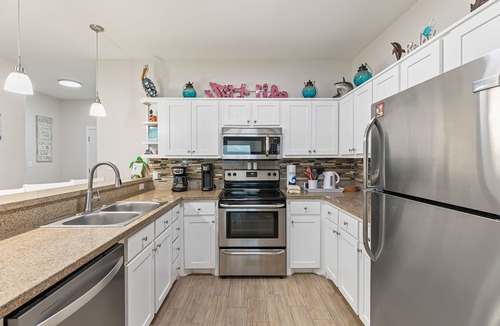 Port Isabel House | Bayfront Home with Shared Pool, Dock, Balcony, Playground and Washer/Dryer