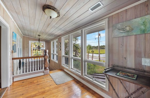 Litchfield by the Sea House | Beach House on Tidal Creek, Dock, Screen Porch, Easy Walk to Beach, Dog Friendly