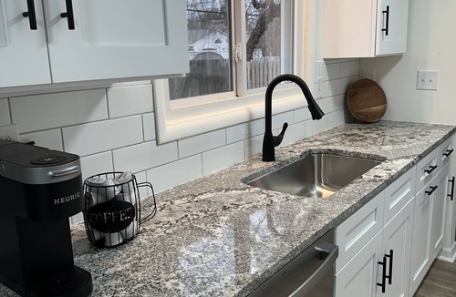 Mentor House | Beaming Mentor Bungalow with great central location and large fenced in yard