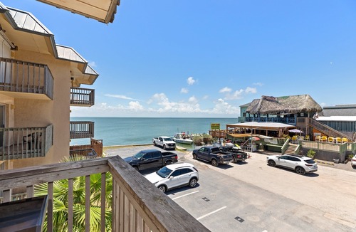 South Padre Island Condo | Beautiful Bayfront Condo with Fishing Pier, Boat Dock & Pool - Next to Louie's!