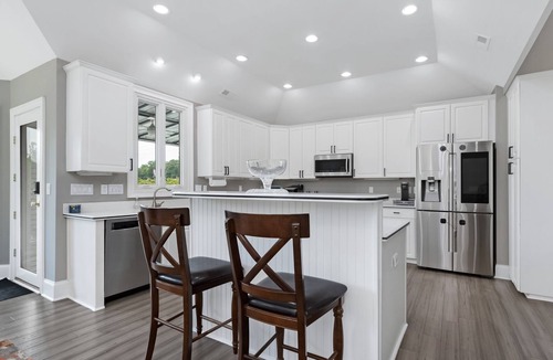India Hook House | Beautiful Waterfront Home with abundant outdoor seating, pool, hot tub, grill