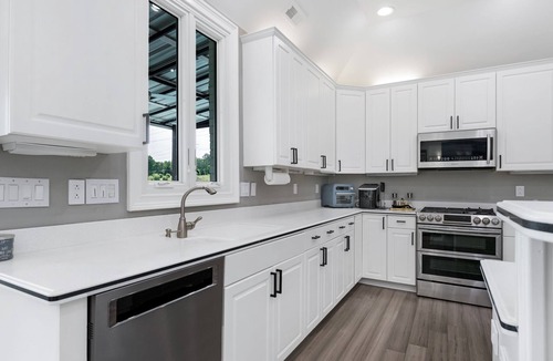 India Hook House | Beautiful Waterfront Home with abundant outdoor seating, pool, hot tub, grill