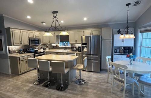 New London House | Bigfoot’s Badin Retreat in Badin Shores Resort - Golf Cart - Family Fun