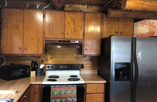 Coram Cabin | Black Bear CabinnA rustic cabin 10 minutes away from Glacier National Park!