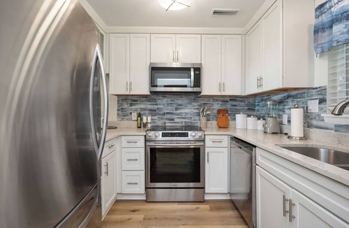 Caswell Beach Condo | By The Ocean Blue: Oceanfront Luxury on Caswell Beach with Community Pool