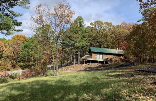 Heavener Cabin | Cabin at Runestone Hideaway just steps from Heavener Runestone Park.