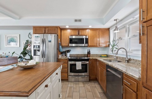 North Carolina Coast Villa | Canal-Front Townhome w/Private Boat Slip, Pool & Beach Access