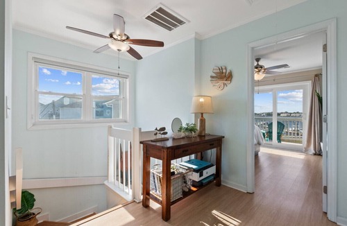 North Carolina Coast Villa | Canal-Front Townhome w/Private Boat Slip, Pool & Beach Access