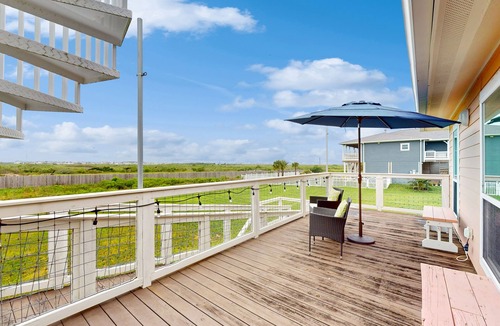 Spanish Grant House | Canal view retreat with vaulted ceilings & three-story observation deck
