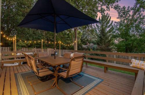 West Omaha House | Central Family Oasis with Hot Tub & Fenced Yard
