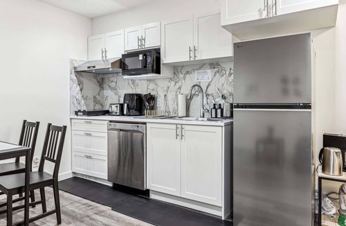 Cranston House | Charming Basement Suite with Parking & Laundry