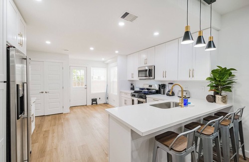 Northside House | Charming private home sleeps 6 in the Heights near Downtown with fast WiFi, smart TVs, ample parking, and a primary king ensuite for added privacy and comfort.