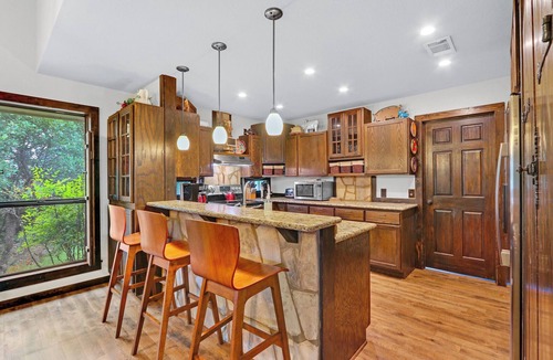 Gruene House | Clutter Falls Retreat with Two Homes, Hot Tubs & Guadalupe River Views