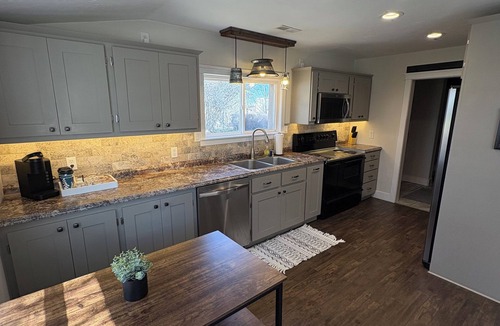 St. Anthony House | Country living house 5 min to sand dunes with large patio, hot tub, and fire pit