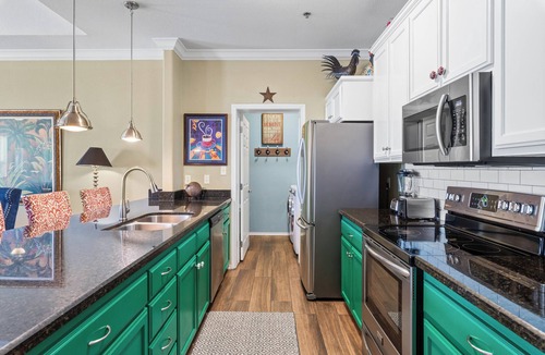 South Padre Island Condo | Courtyard condo with pool only 1/4 block to beach!
