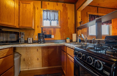 Cody Apartment | Cowboy Bunkhouse #1, rustic charm, located in South Fork Valley, 10 minutes from Downtown Cody