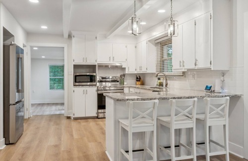 Southmont House | Cozy Cove-Lakefront home with kayaks, paddle board, lillypad, arcade, & fire pit