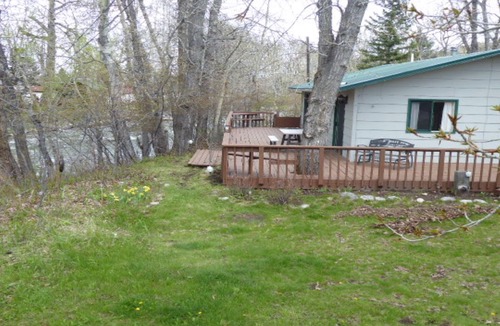 Red Lodge Cabin | Cozy Getaway in Town! Enjoy Rock Creek Flowing Just Steps from Wrap Round Deck