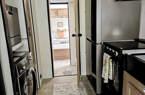 Kurtz RV Rental | Cozy glamper with scenic pond in Brownstown Indiana