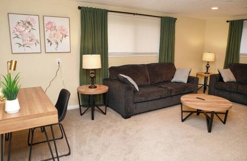 Commerce Township House | Cozy spacious 4-bedroom home nestled in wooded lot with enclosed porch