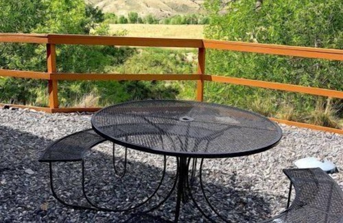 Cody Apartment | Creek Side Cabin #1 in the Wapiti Valley and steps from Trout Creek