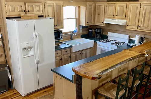 Ellijay Cabin | Creekfront Cabin with Waterfall. Hot Tub, Fire Pit, Gameroom, and more.